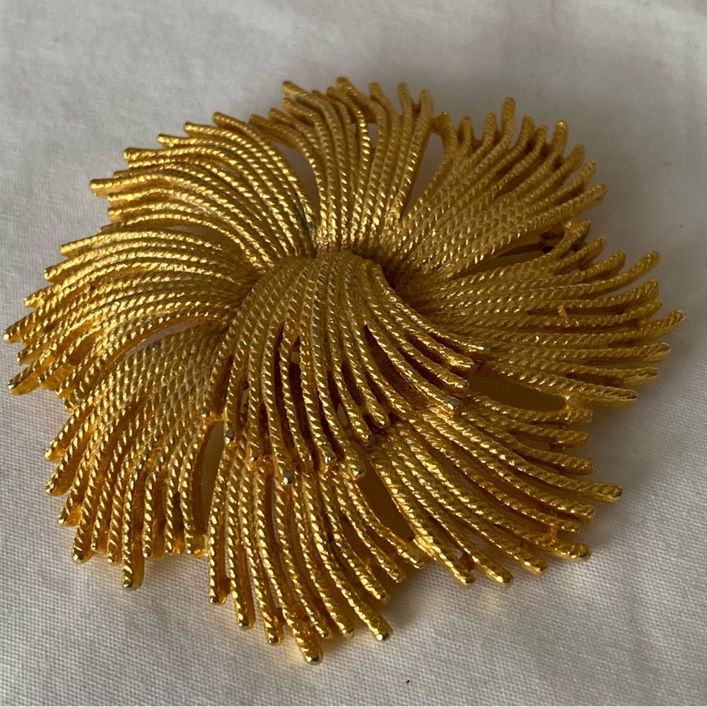 Gold Tone Spiral Brooch with Intricate Design